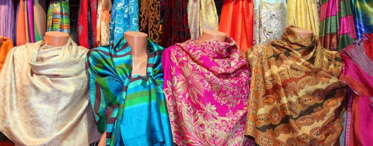 stock-photo-colorful-scarfs-in-line-at-market-27456772